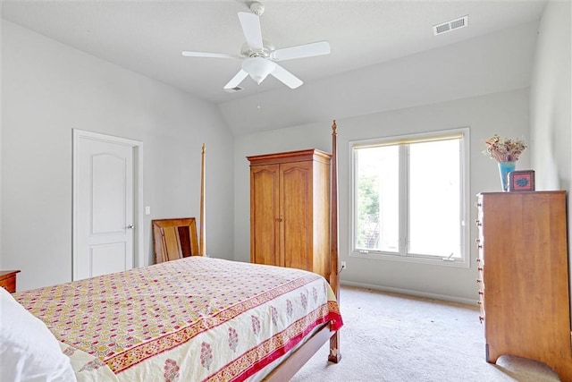 carpeted bedroom with lofted ceiling and ceiling fan