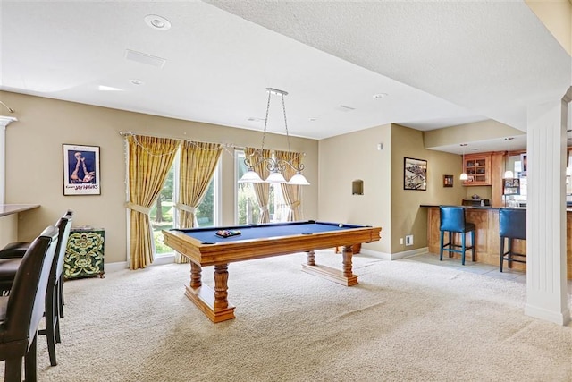 recreation room featuring billiards, light colored carpet, and indoor bar