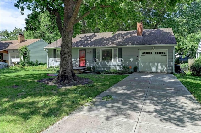 single story home with a front yard and a garage