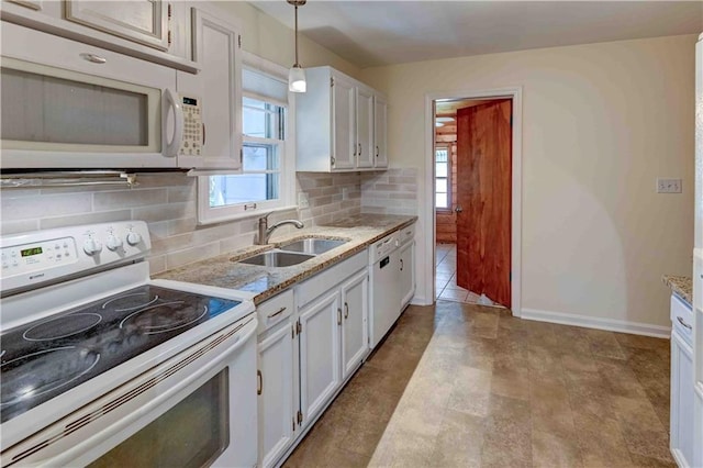 kitchen with white appliances, light tile patterned floors, tasteful backsplash, and sink