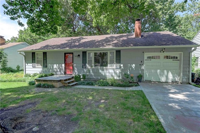 ranch-style home with a front yard and a garage