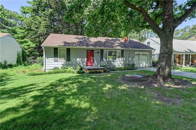 single story home featuring a front yard and a garage