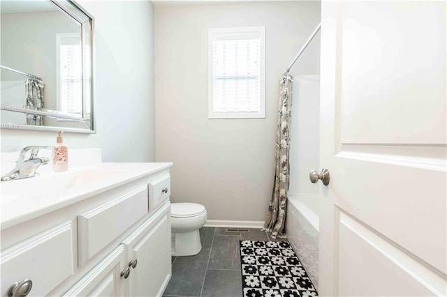 bathroom featuring toilet, shower / bath combination with curtain, a healthy amount of sunlight, and vanity