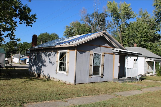 view of home's exterior featuring a yard