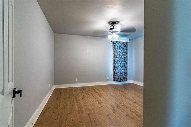 unfurnished room featuring hardwood / wood-style flooring and ceiling fan