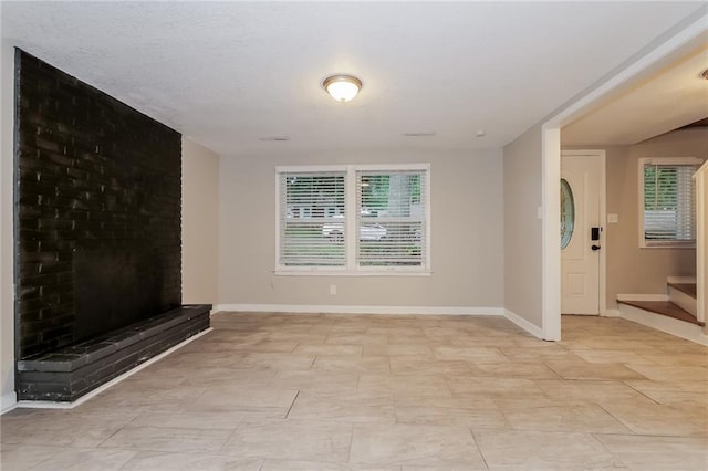 unfurnished living room with a fireplace