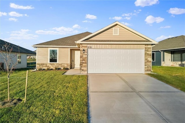 view of front of property with a front yard and a garage