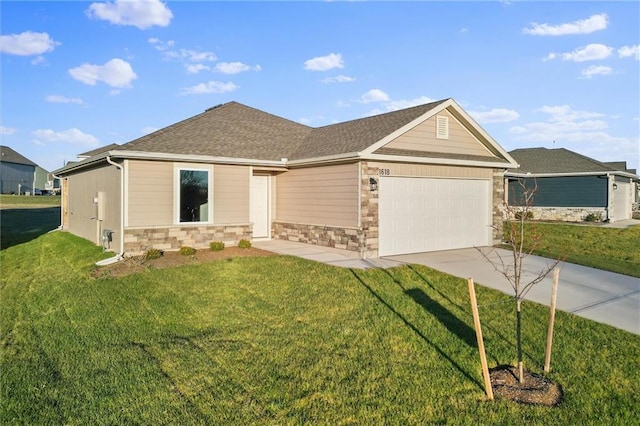 view of front facade with a garage and a front lawn