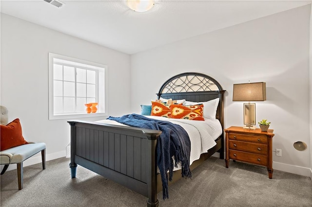 bedroom with carpet flooring, visible vents, and baseboards