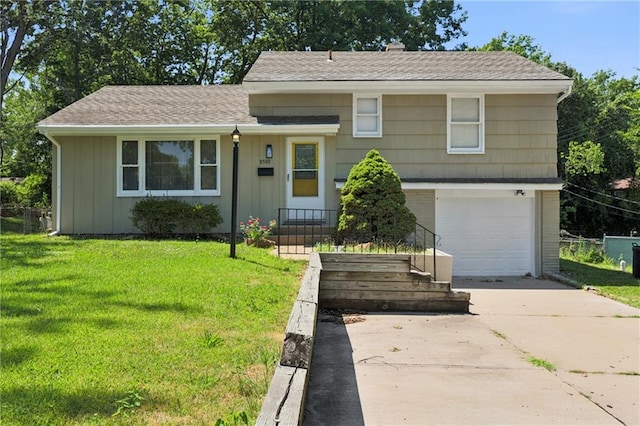 view of front facade featuring a garage and a front lawn