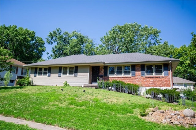 ranch-style home featuring a front yard