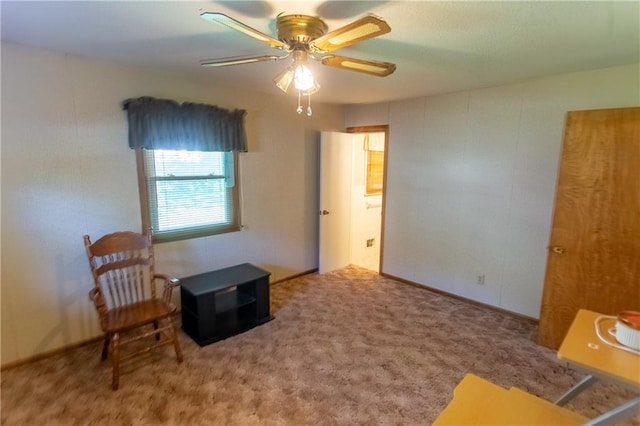 sitting room featuring ceiling fan and carpet