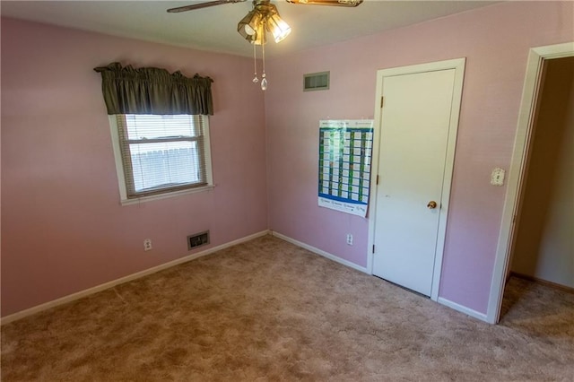 unfurnished bedroom featuring ceiling fan and light colored carpet