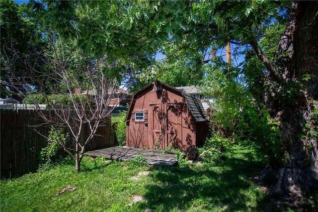 view of outbuilding featuring a yard