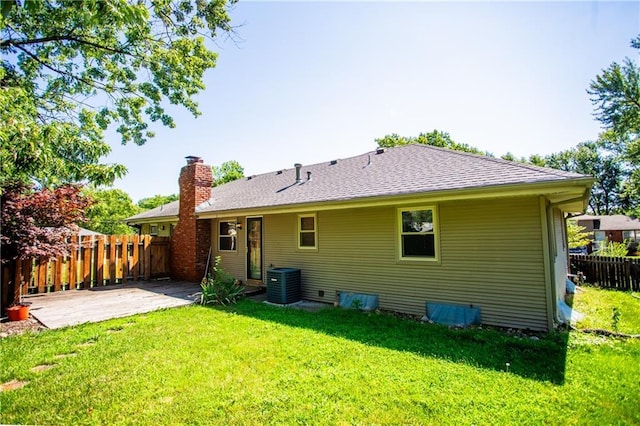 back of property featuring a patio, a yard, and cooling unit