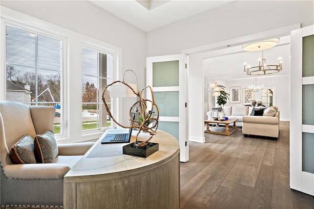 office area featuring an inviting chandelier and dark wood-type flooring