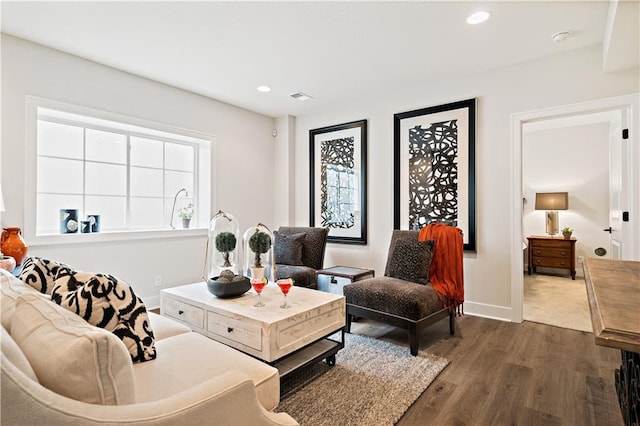 living room with dark hardwood / wood-style flooring