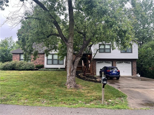 view of front of house with a front lawn and a garage