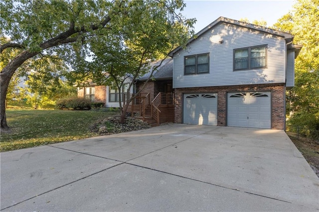 view of front of property with a garage and a front lawn