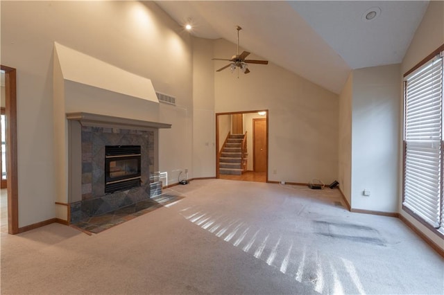 unfurnished living room with carpet and a wealth of natural light