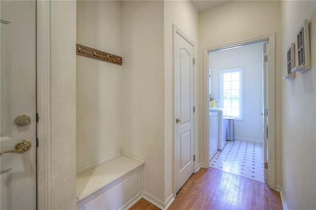 mudroom with light hardwood / wood-style floors