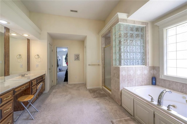 bathroom featuring vanity and shower with separate bathtub