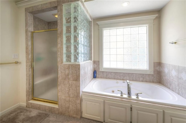 bathroom with separate shower and tub