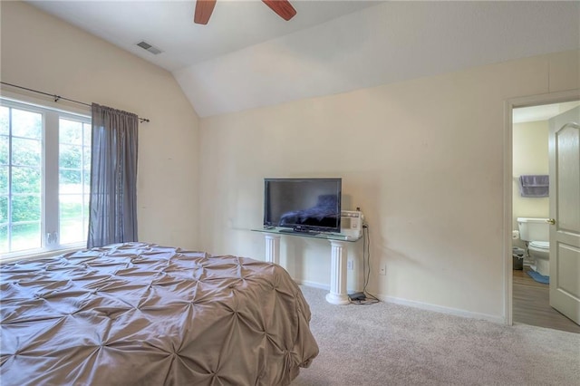 bedroom with ceiling fan, vaulted ceiling, and carpet