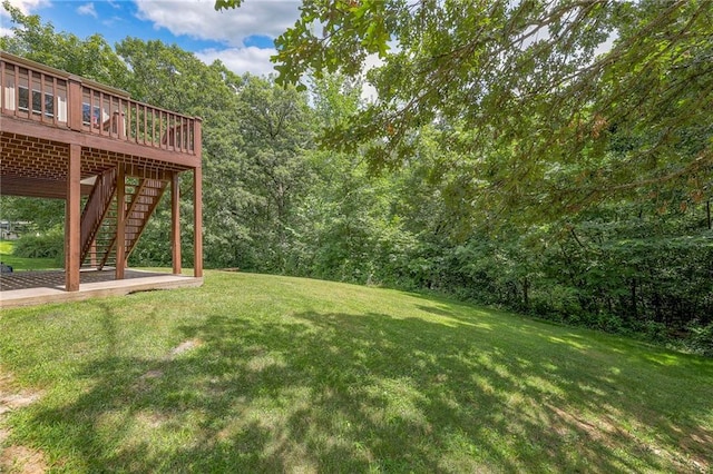 view of yard with a wooden deck