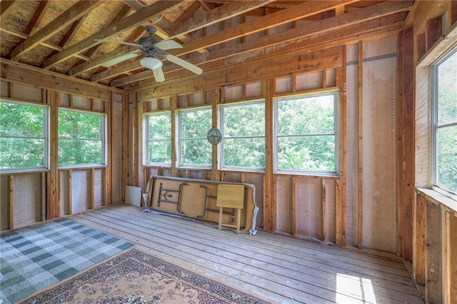 miscellaneous room with ceiling fan, a healthy amount of sunlight, and wood-type flooring