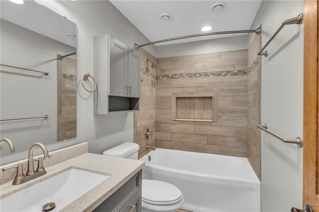 bathroom featuring shower / washtub combination, toilet, and vanity