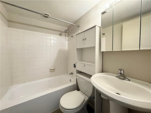 full bathroom with sink, toilet, and shower / washtub combination