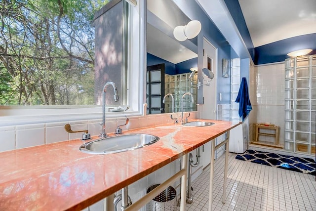 bathroom featuring tile patterned flooring and vanity