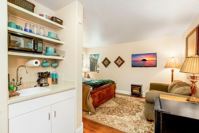 interior space with sink and light hardwood / wood-style flooring