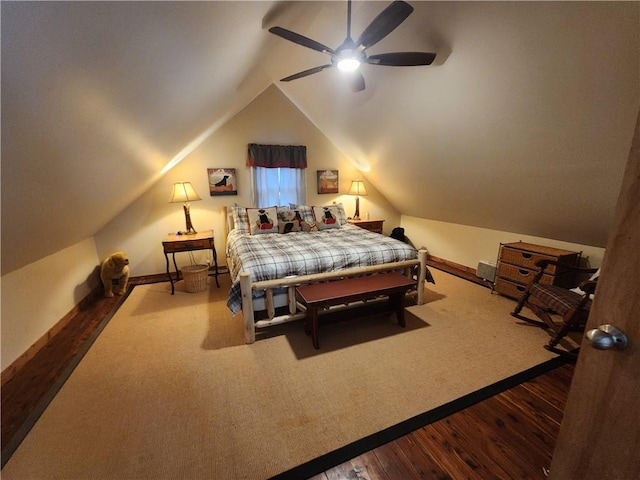 bedroom featuring ceiling fan, wood-type flooring, and vaulted ceiling