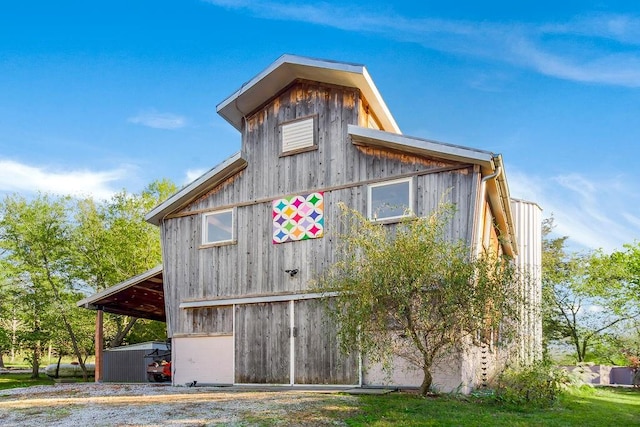 view of home's exterior with an outdoor structure