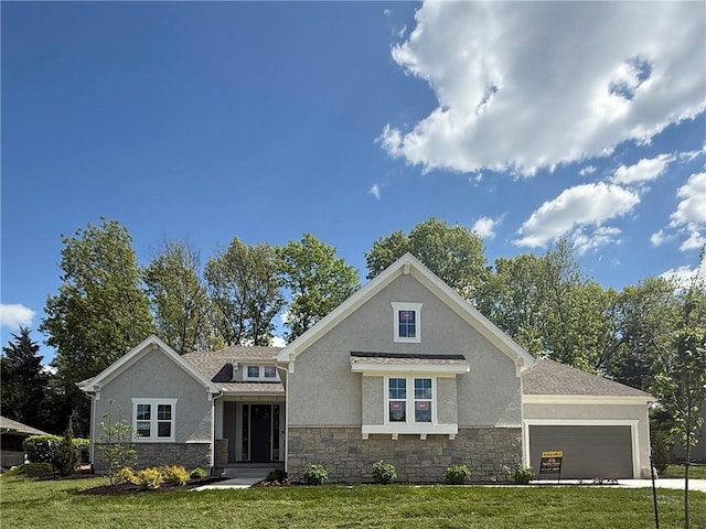 view of front facade with stone siding, a garage, stucco siding, and a front yard