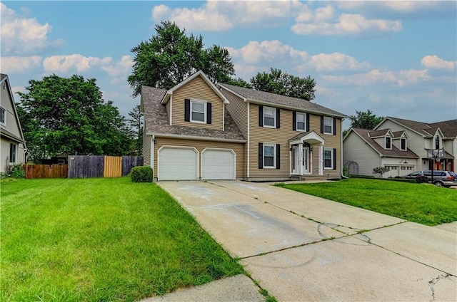 view of front of property featuring a garage and a front lawn