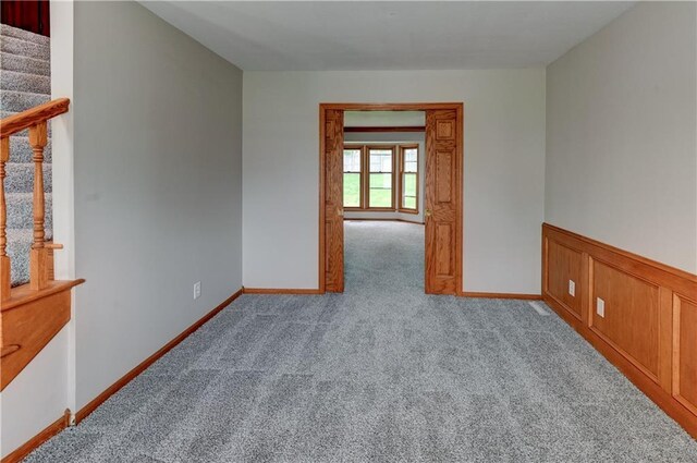 unfurnished room with light carpet