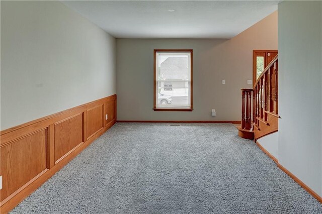 unfurnished room with light carpet