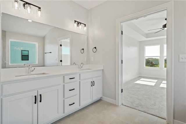 bathroom featuring tile patterned flooring, vanity, and ceiling fan