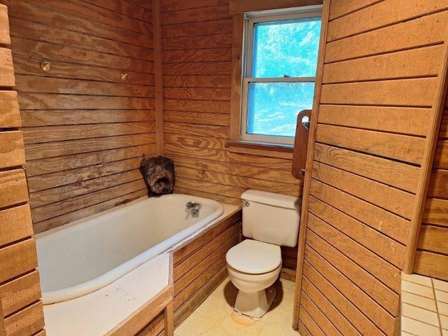 bathroom featuring a bath and toilet