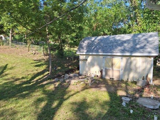 view of outdoor structure with a yard