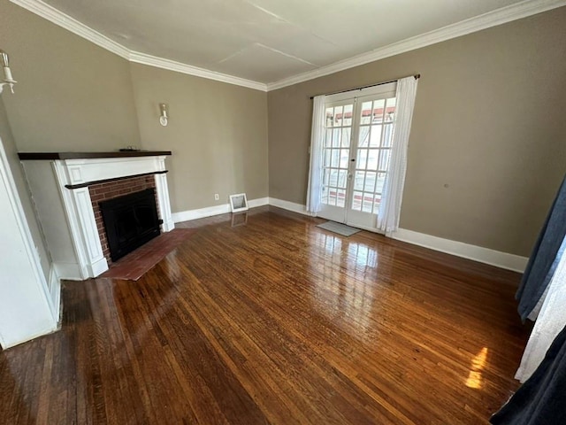 unfurnished living room featuring baseboards, ornamental molding, french doors, a fireplace, and wood finished floors