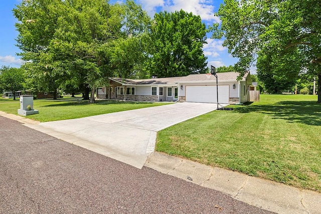 ranch-style house with a garage and a front lawn