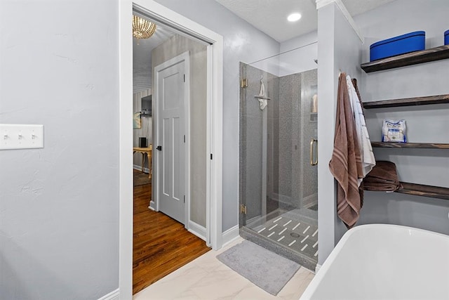 bathroom featuring tile patterned flooring and separate shower and tub