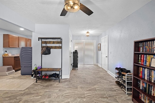 hallway featuring a textured ceiling