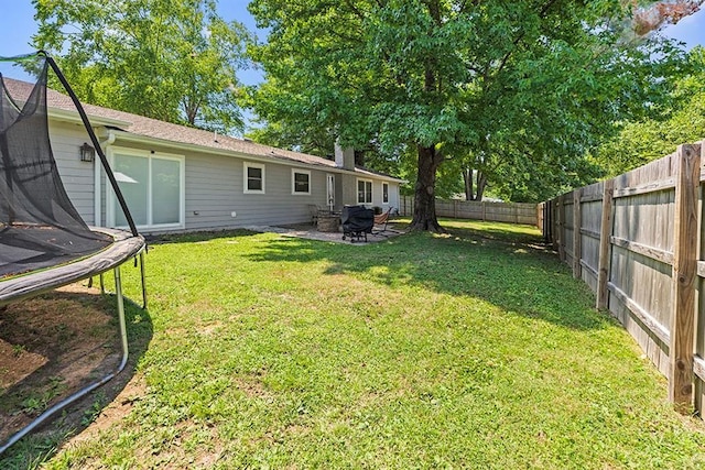 view of yard with a trampoline