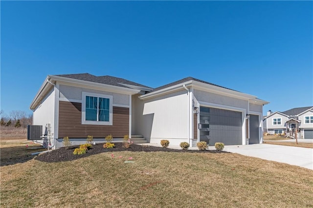 view of front of house featuring cooling unit, driveway, a front lawn, and an attached garage