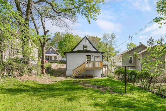 rear view of house with a lawn